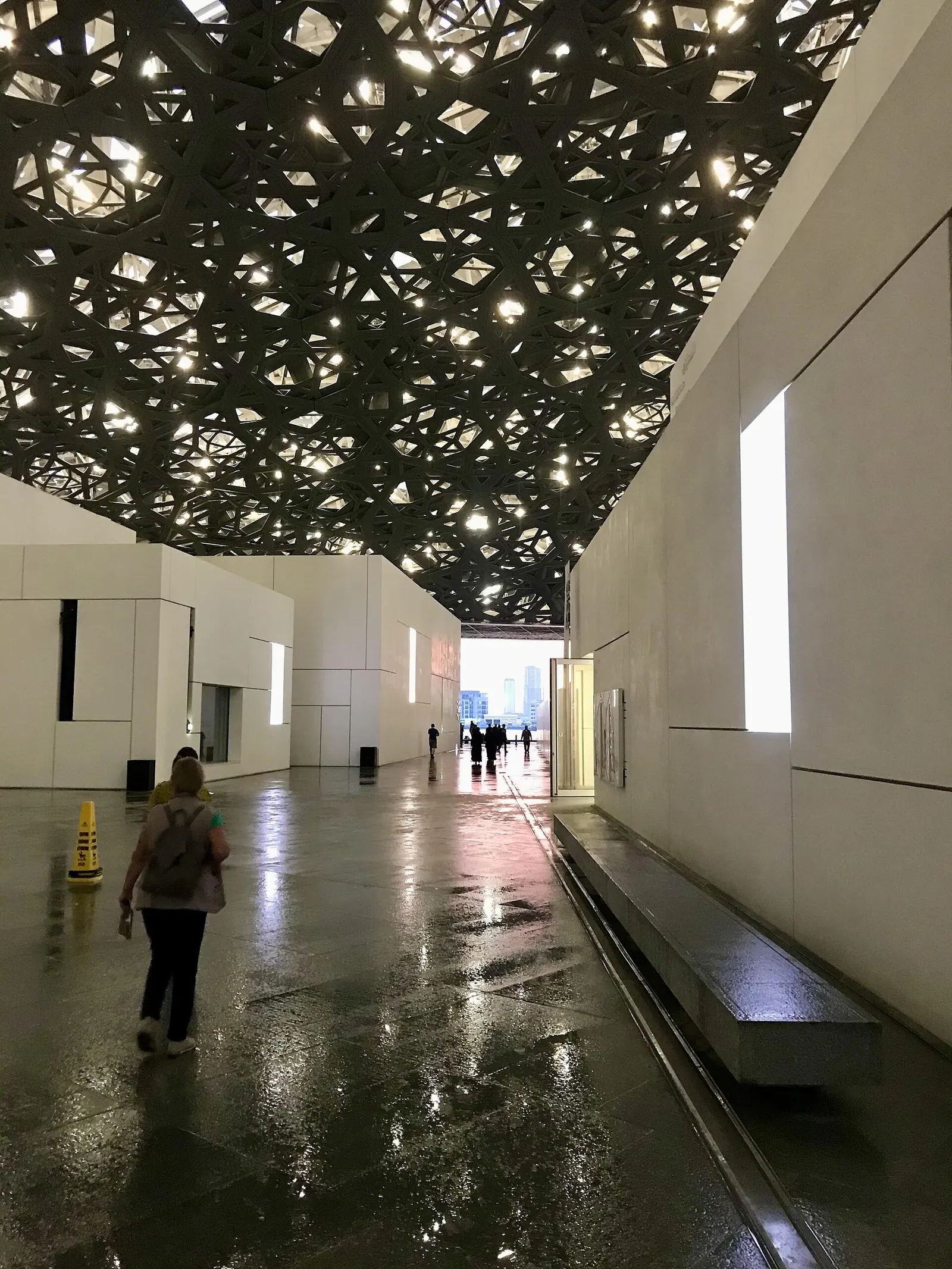 Futuristic domed architecture of Louvre Abu Dhabi art museum on the water