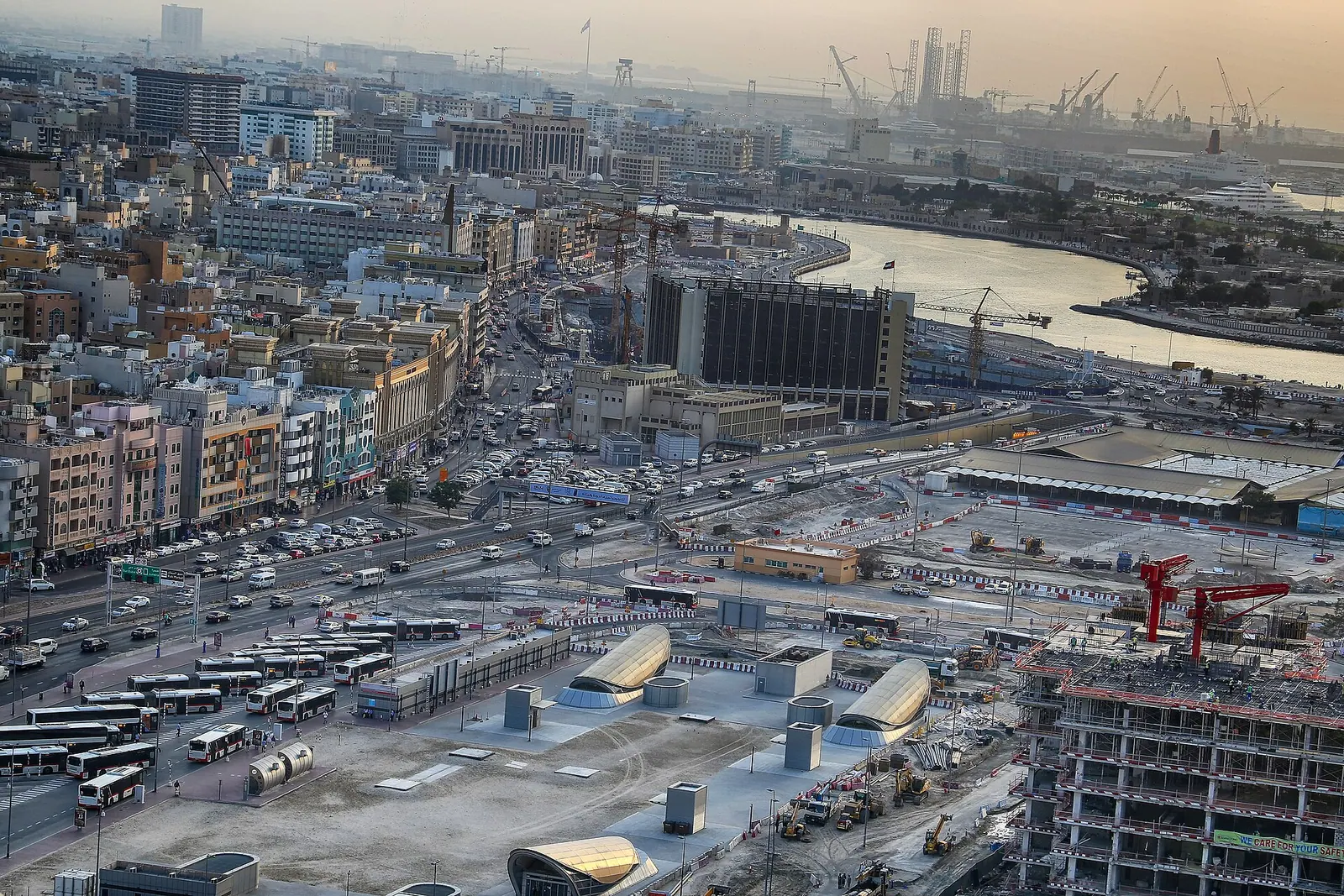 Traditional dhow boats on Dubai Creek at sunset